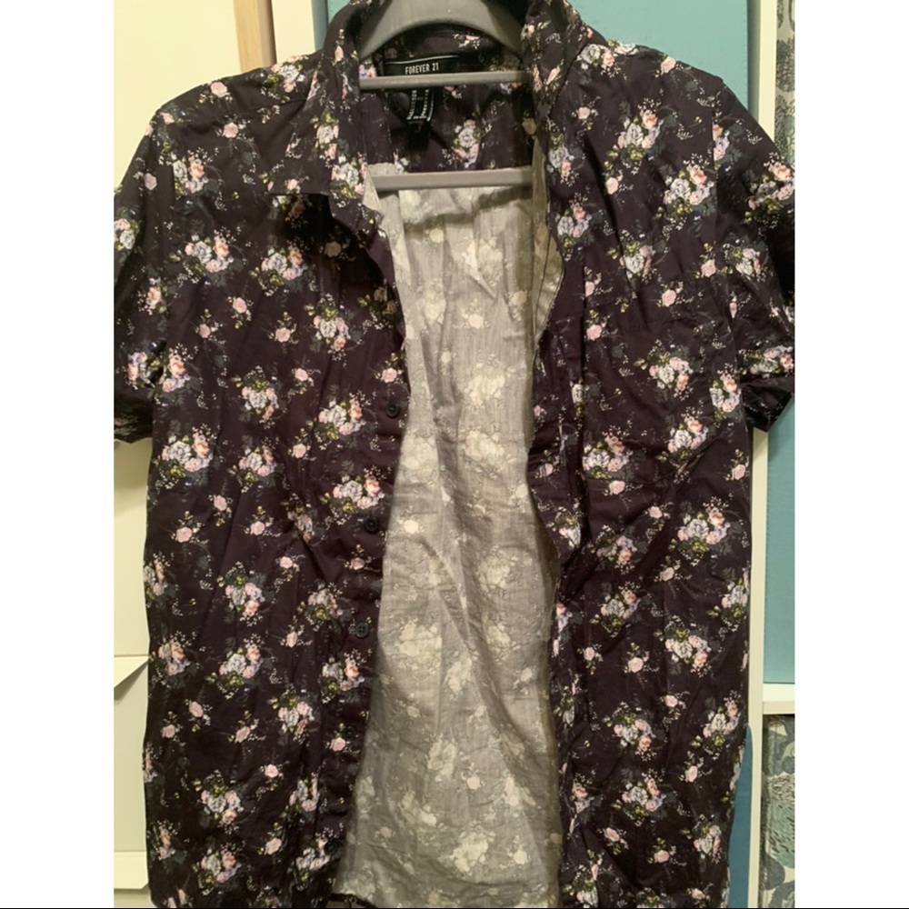 Two men’s floral button ups size medium